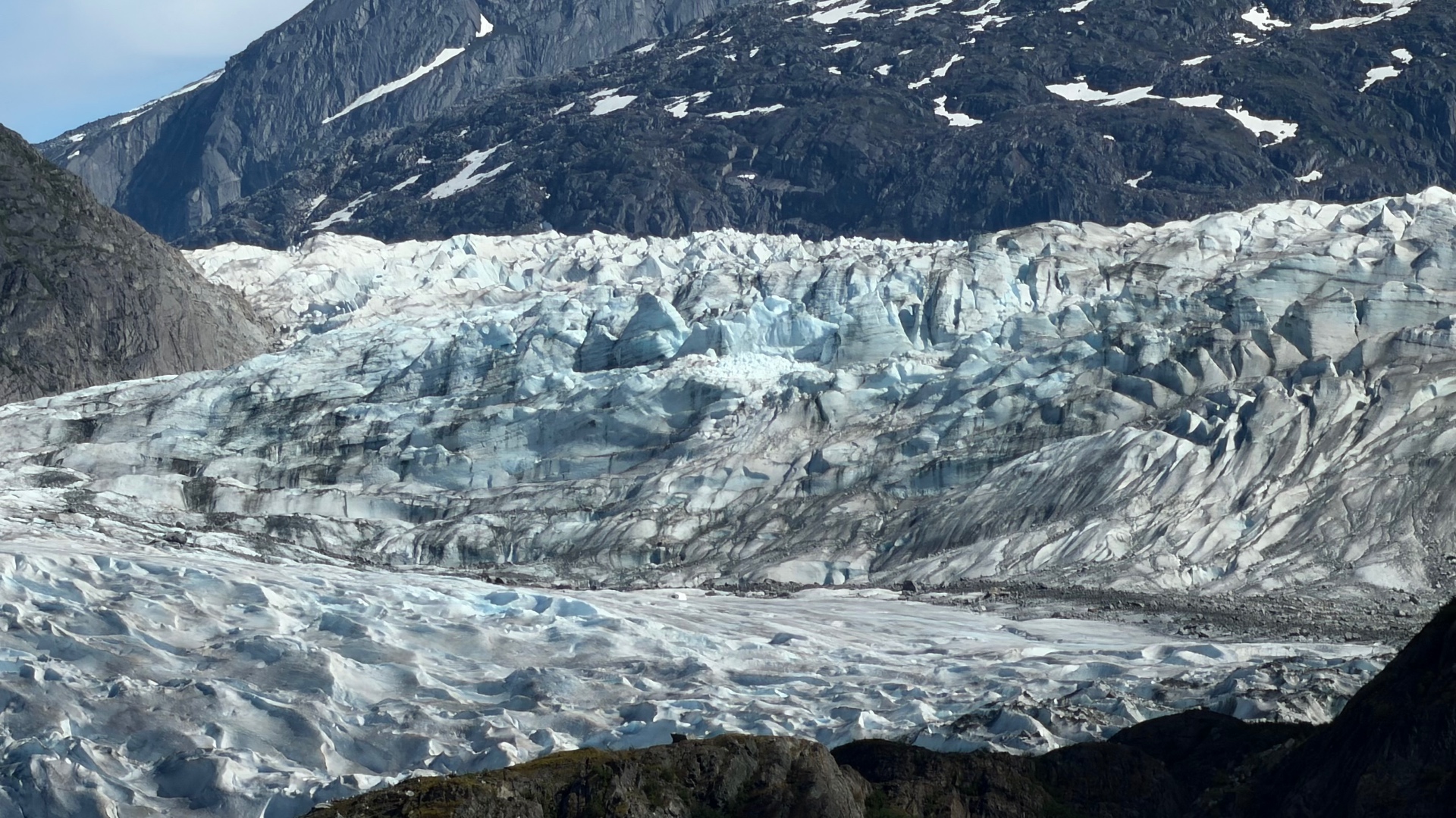 Close view of the textured blue-white ice of Mendenhall Glacier