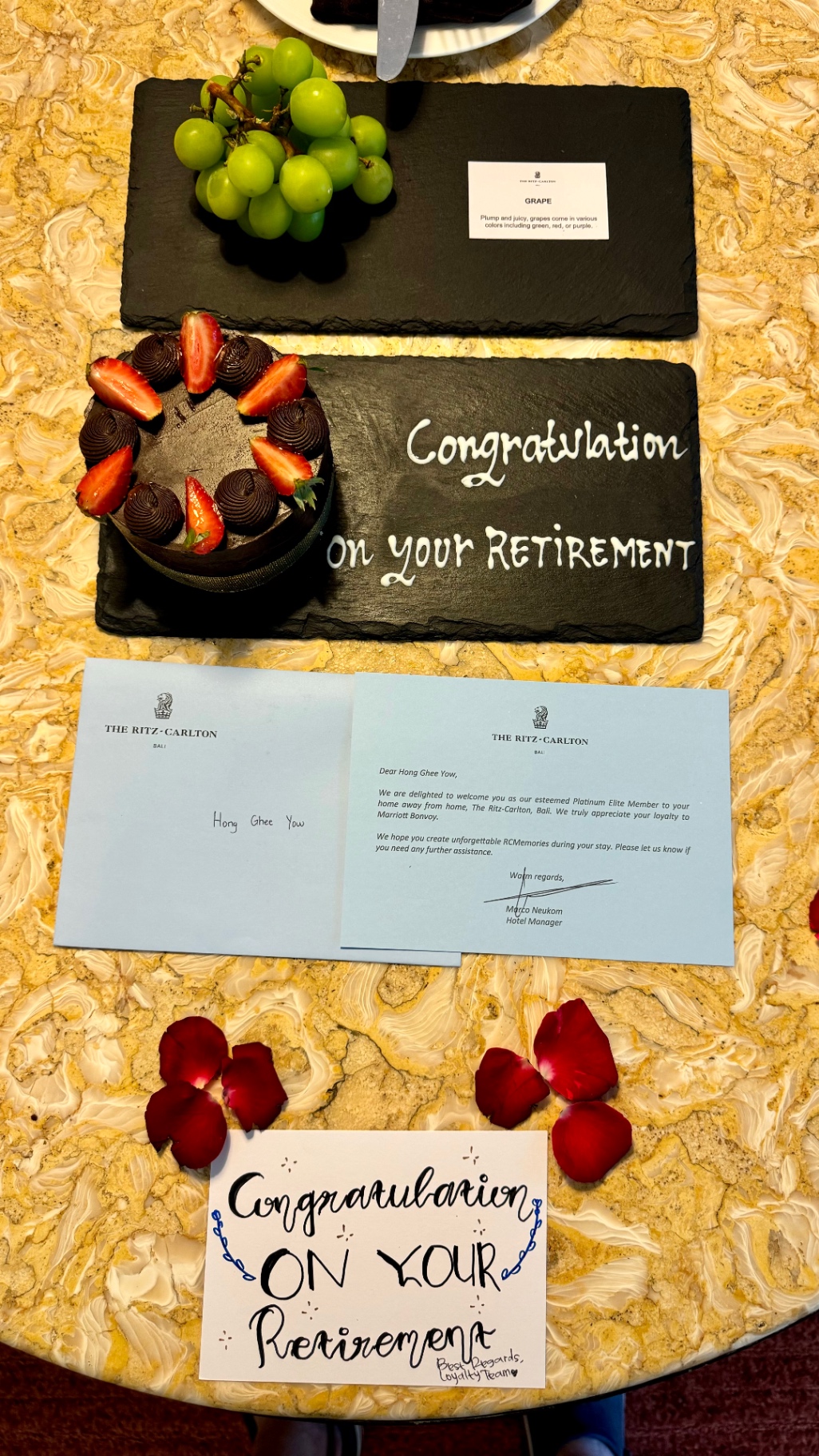 Retirement cake, fruit and welcome cards at the Ritz-Carlton Bali