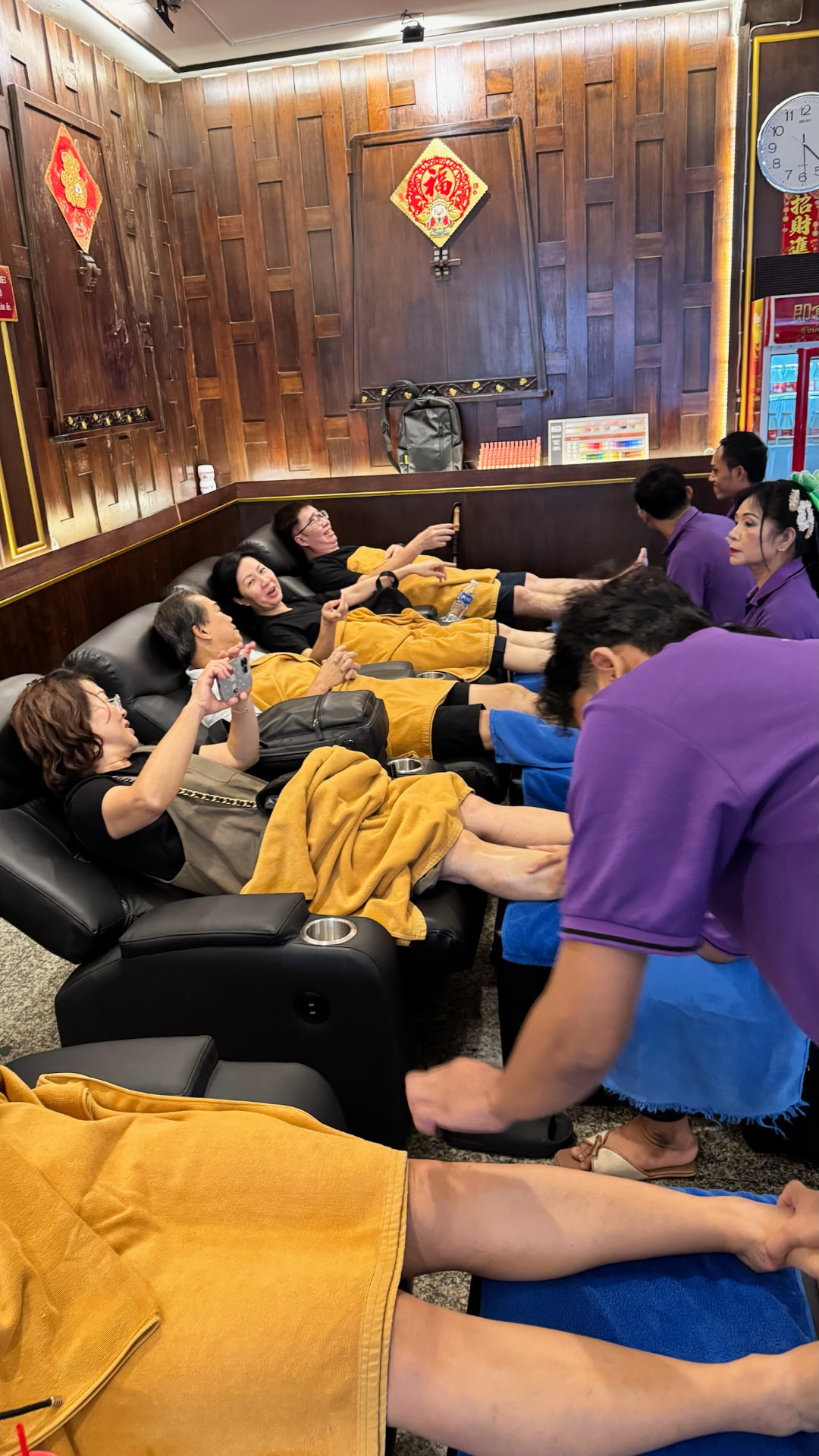 Friends relaxing together during a Bangkok foot massage