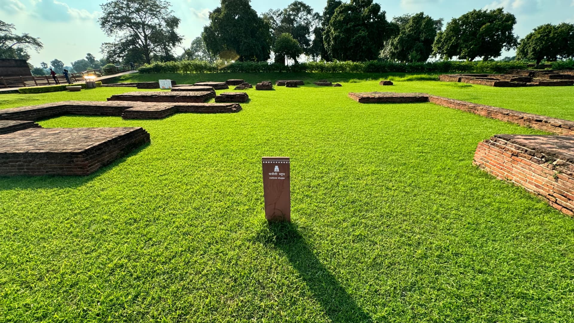 Low foundations and grassy courtyards reveal the layout of the ancient complex. — Nalanda, Bihar, India · Patna chapter.