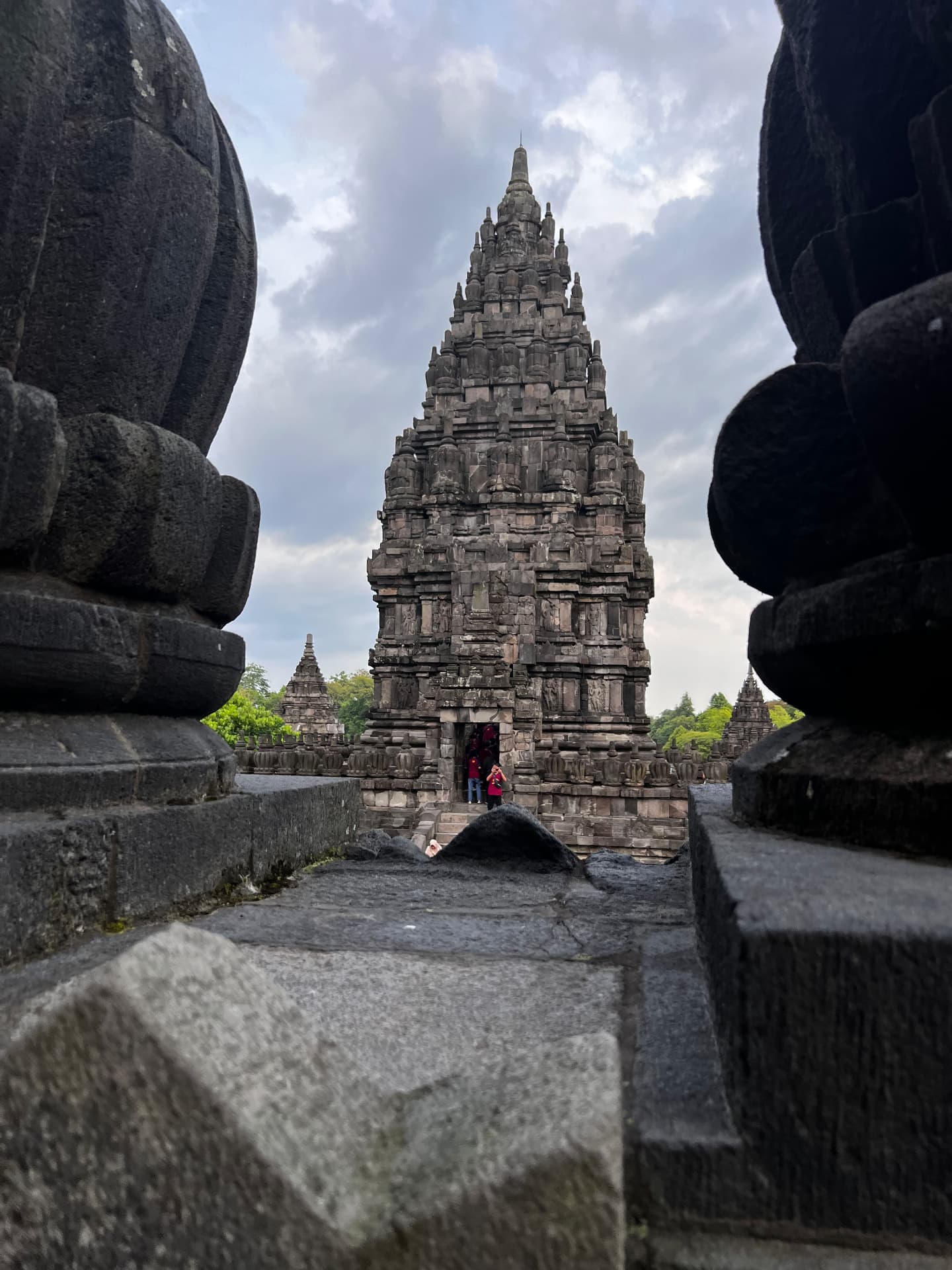 Prambanan temple viewed between carved stone structures