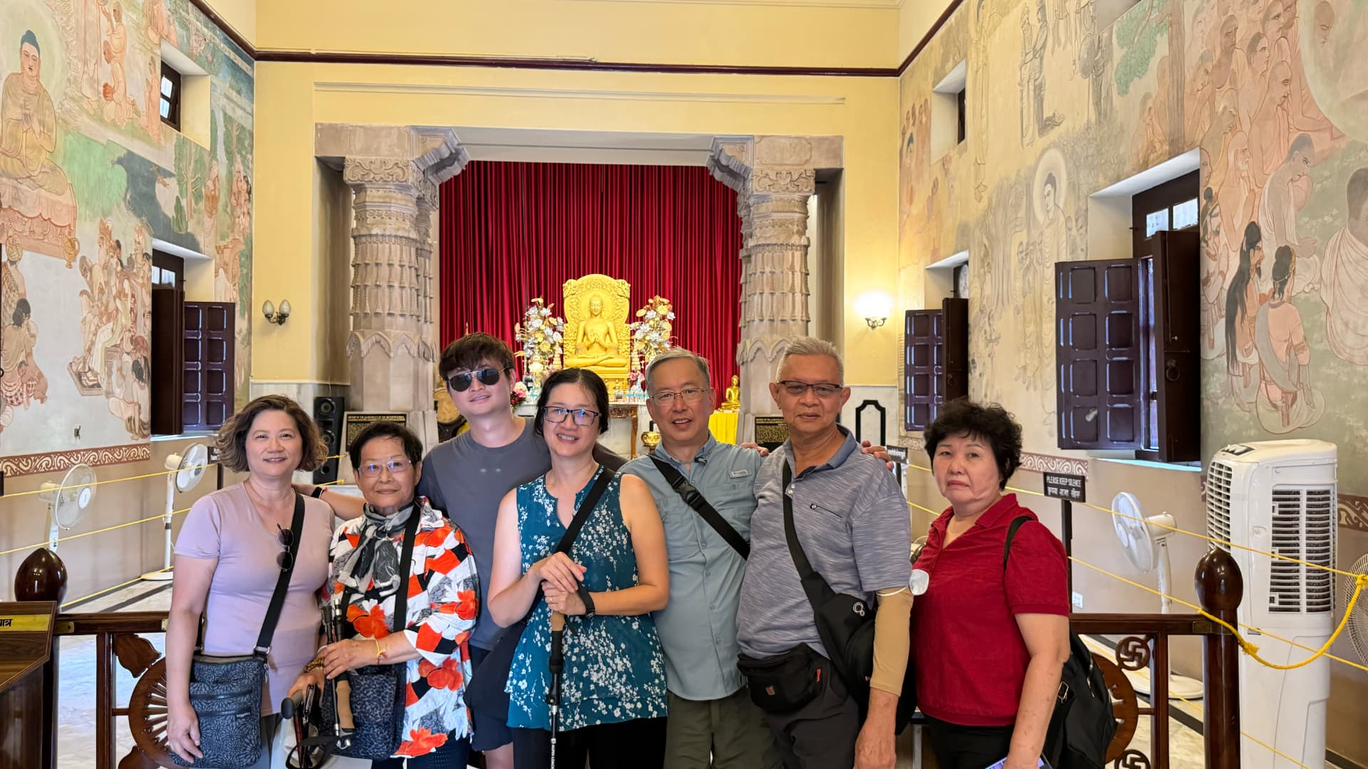 Our group gathers in front of the golden Buddha inside the temple. — Sarnath, Uttar Pradesh, India.