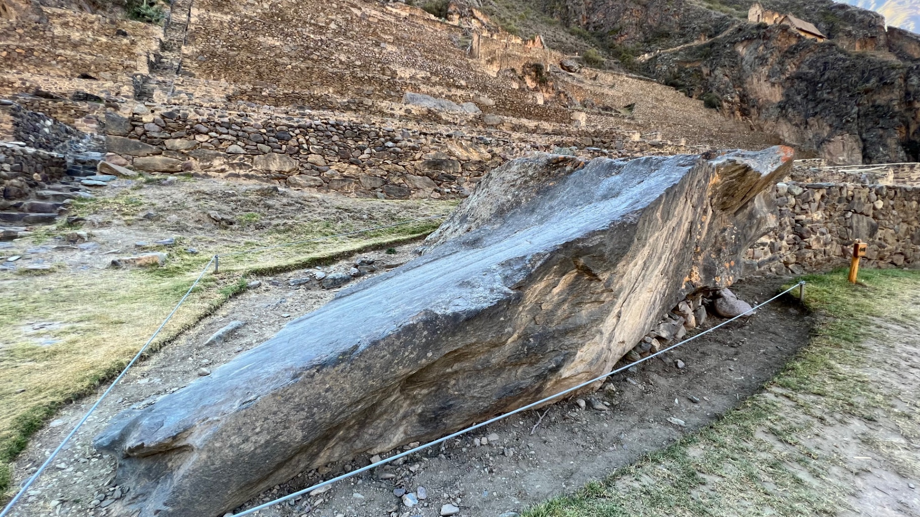 Ancient stone water channel carrying a clear mountain stream