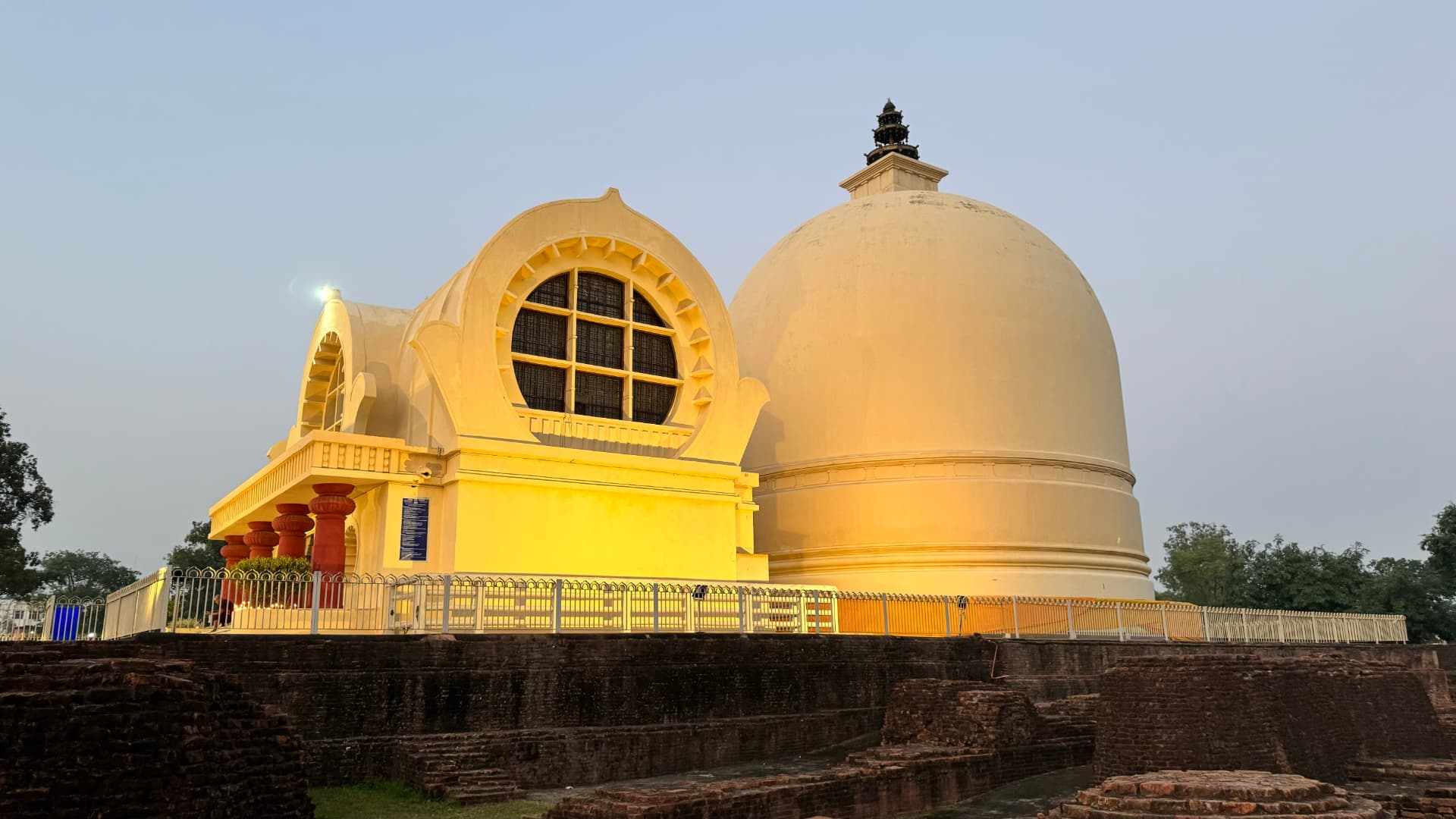 The rounded forms of the Nirvana Temple in warm light. — Kushinagar, Uttar Pradesh, India.