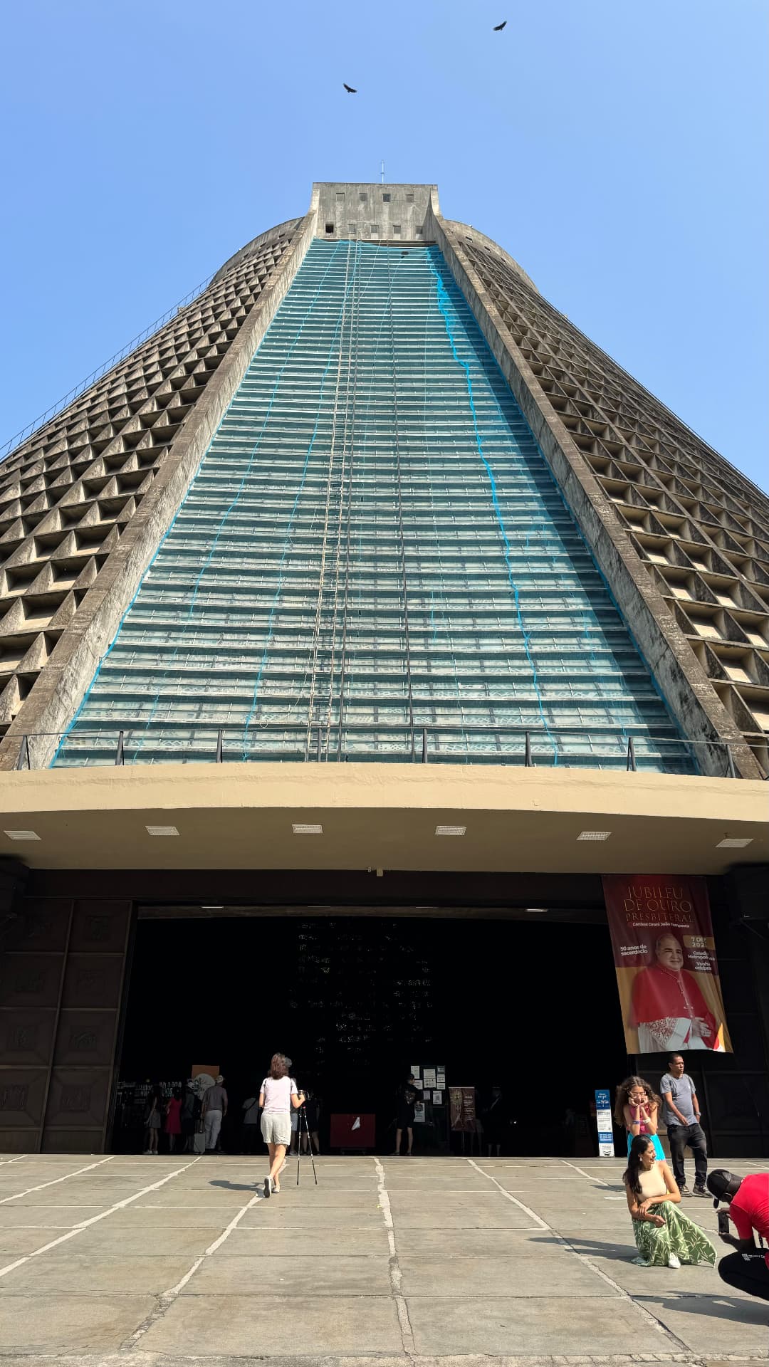 Low view up the Metropolitan Cathedral's tapered concrete façade