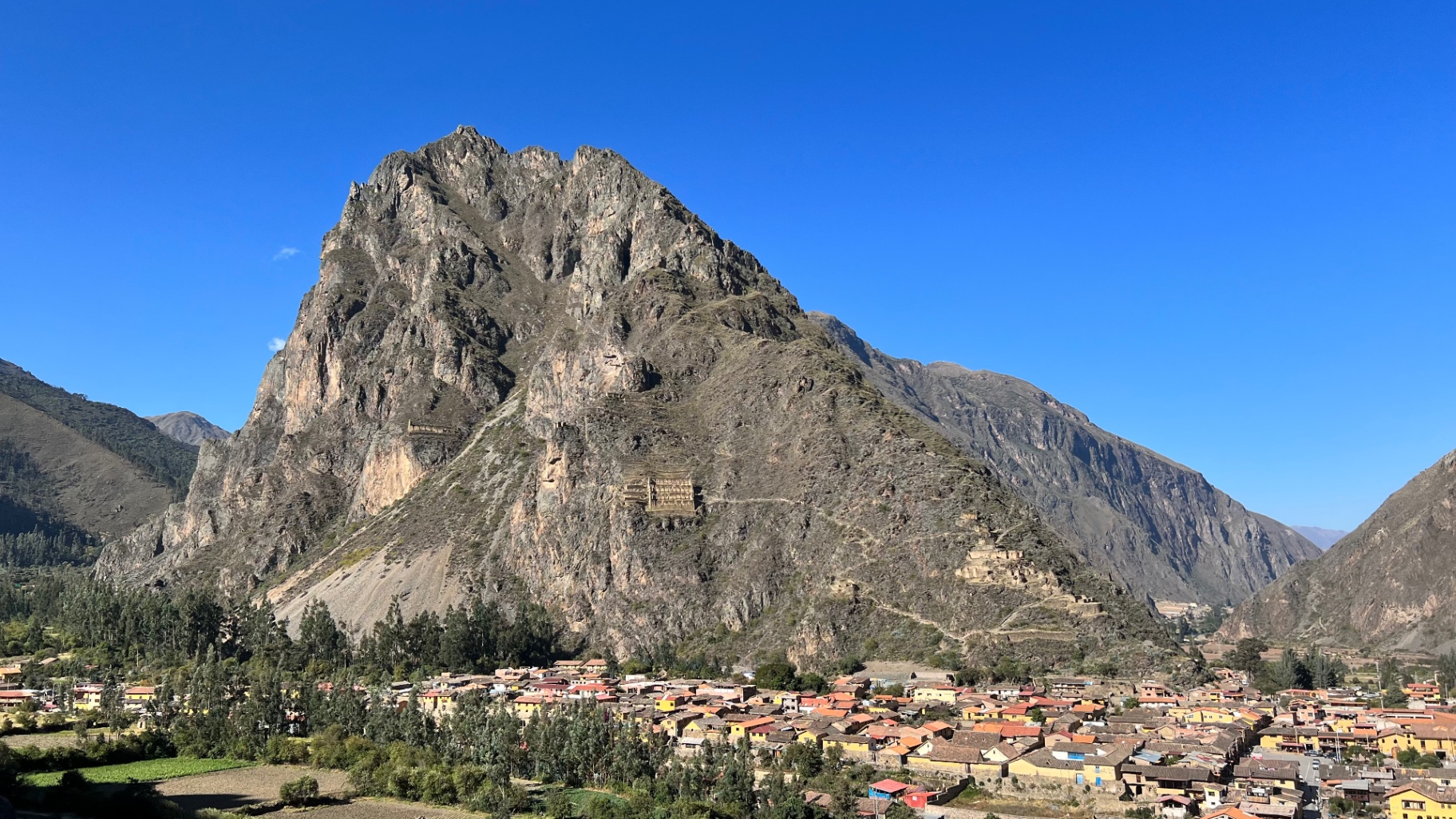 Town and archaeological site enclosed by sheer Andean mountains